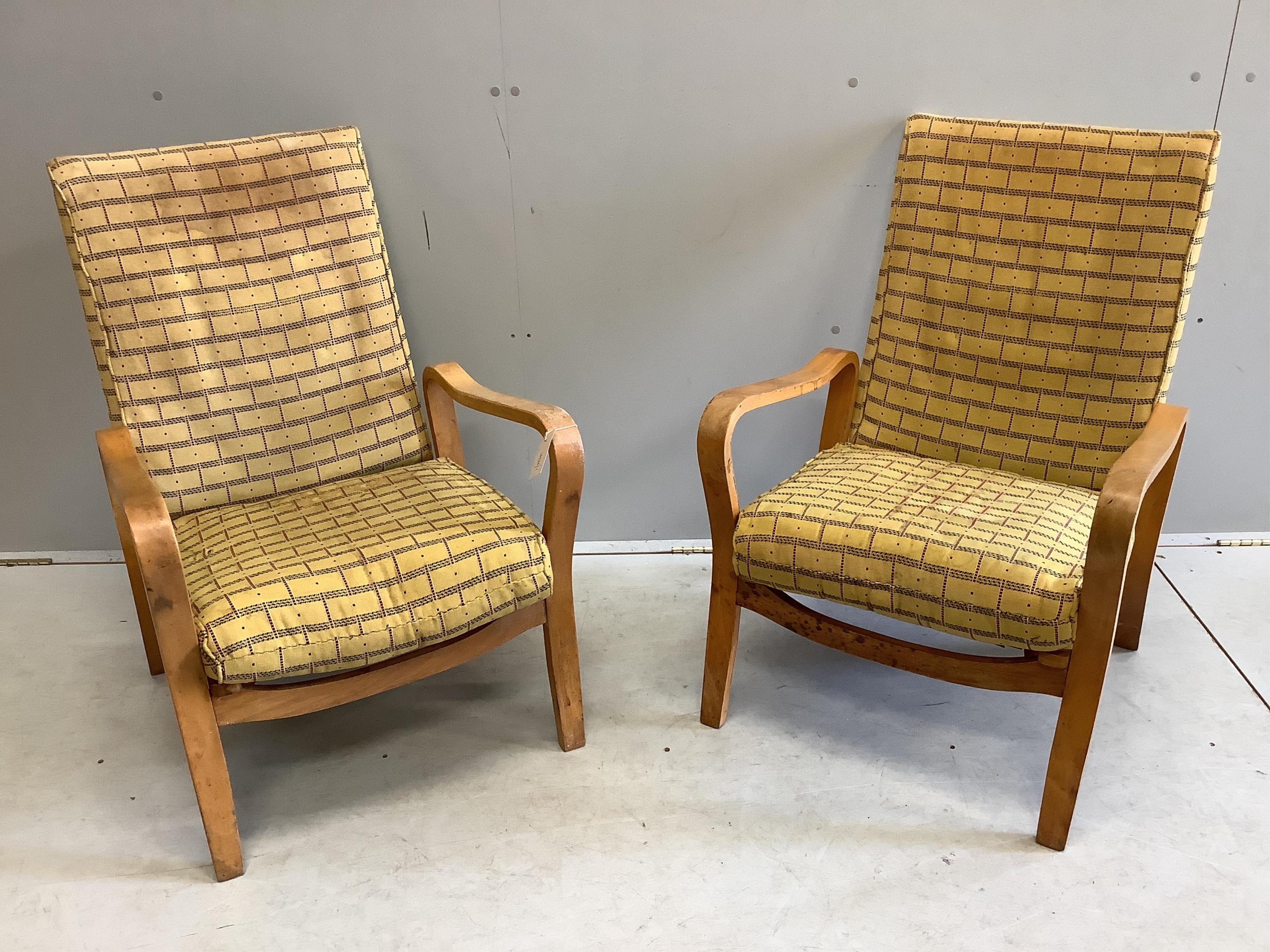 A pair of mid century Eric Lyons Tecta armchairs, width 56cm, depth 54cm, height 85cm. Condition - fair, upholstery poor